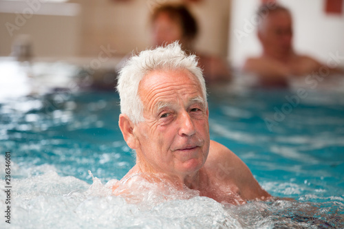 Elderly man in pool