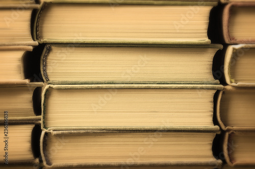 Many old books stacked in texture