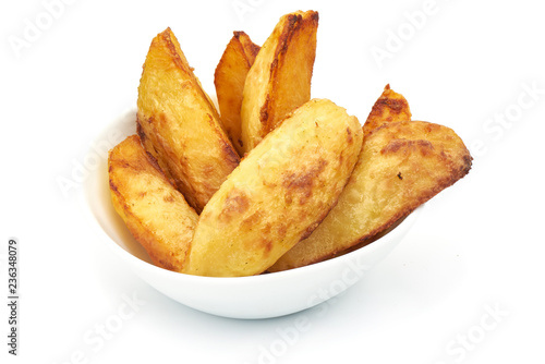 Potato Wedges Fresh baked, isolated on a white background. Close-up