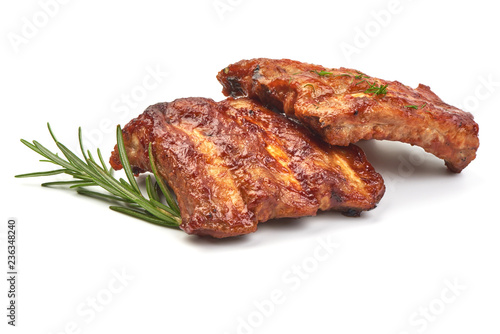 Delicious Grilled Ribs with herbs, isolated on a white background. Close-up