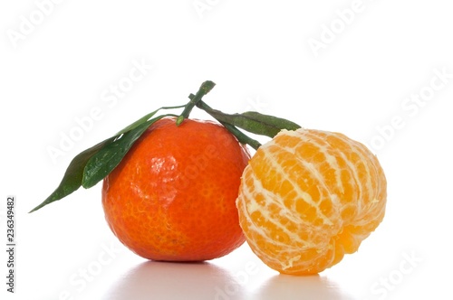 tangerines with leaves isolated on white background