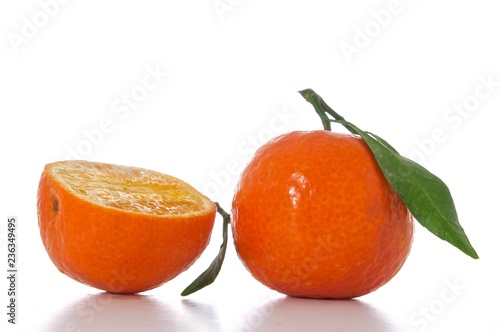 tangerine with green leaf isolated on white background