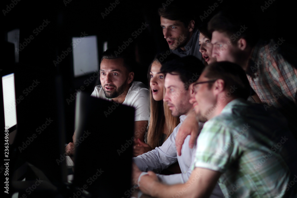 successful business team in the workplace at night successful business team in the workplace at night