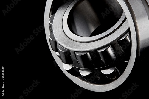 Close-up of a set of ball and roller bearings on a dark background