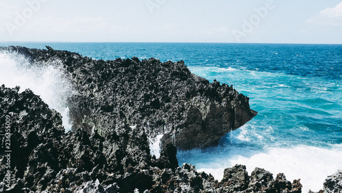 Waves crashing against rocks at the Blow Hole in Nusa Dua, Bali