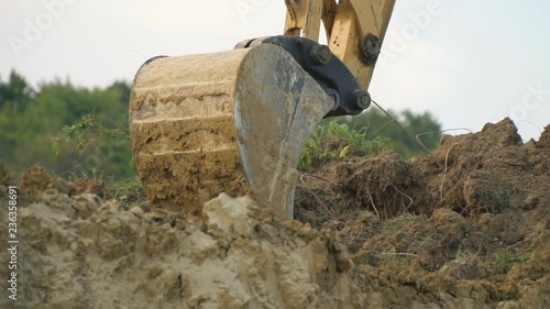 excavator loads a truck