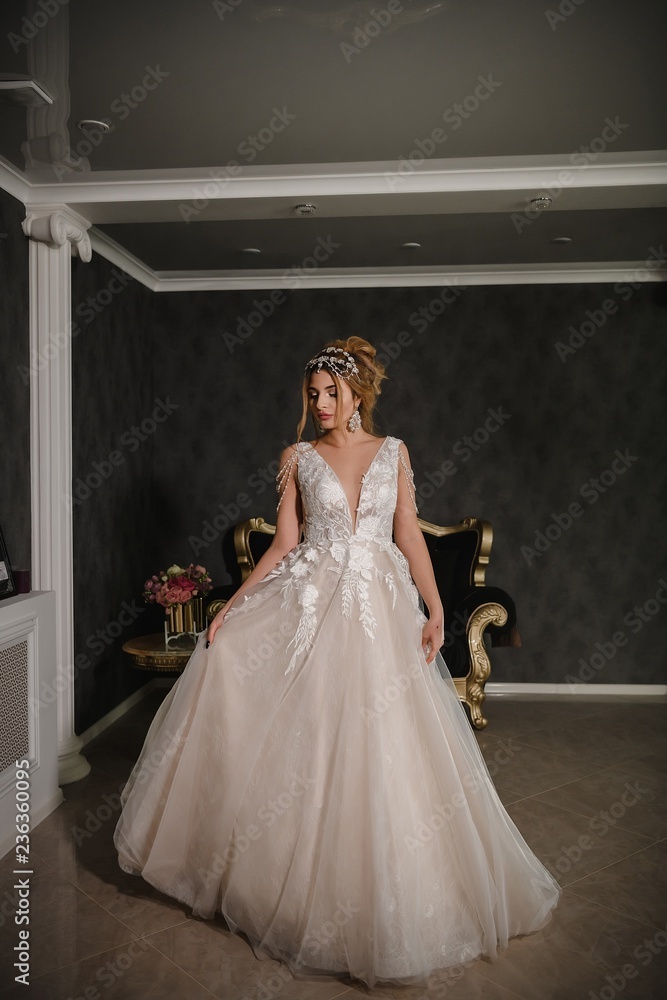 Beautiful model in a modern wedding dress. Beautiful model in a modern wedding dress.