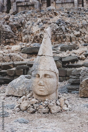 Adiyaman / Turkey - 11.10.2018: Head of Apollo on top of Mount Nemrut. Statues and sculptures on top of Mount Nemrut, monumental site belonging to the Kingdom of Commagene photo