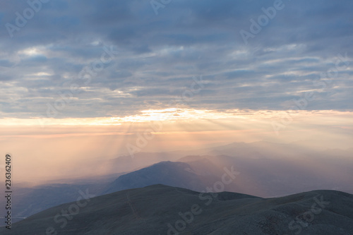 Sunset view from top of a mountain. View from Mount Nemrut, Turkey during golden hour.  © Elif