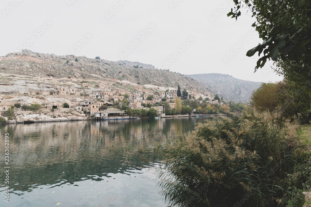 Amazing view of Savasan Village in Turkey located in Halfeti, Sanliurfa Province. Partially submerged and abandoned due to a dam project on Euphrates river. Old town in Halfeti, Turkey lost underwater