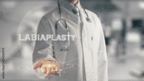 Doctor holding in hand Labiaplasty photo