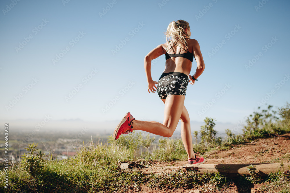 Fitness woman running on a hill Fitness woman running on a hill