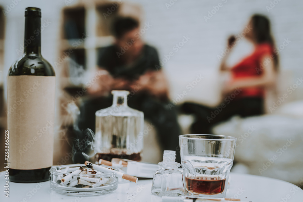 Cigarettes and Alcohol on Table