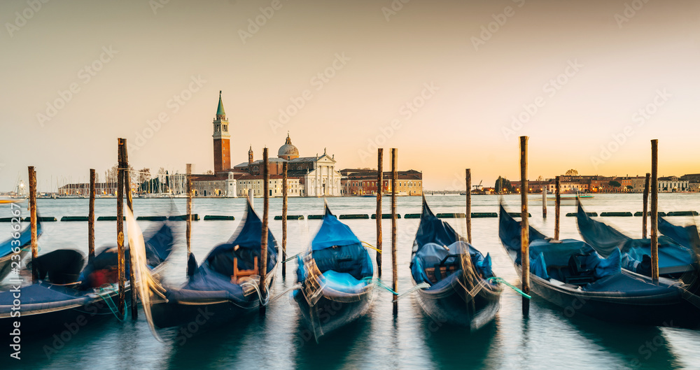 Venice, Italy - Grand Canal, in the foreground Gondolas moored in the background the church of San Giorgio Maggiore