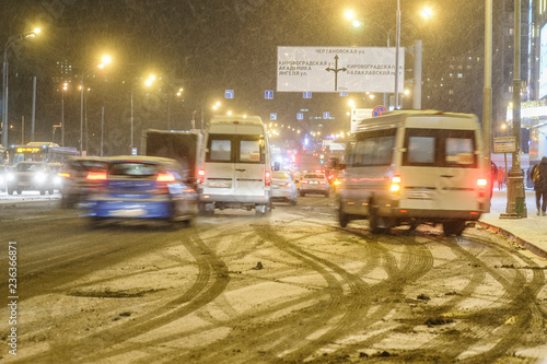 Moscow, Russia - November, 28: cars on a highway in an evening at snowstorm