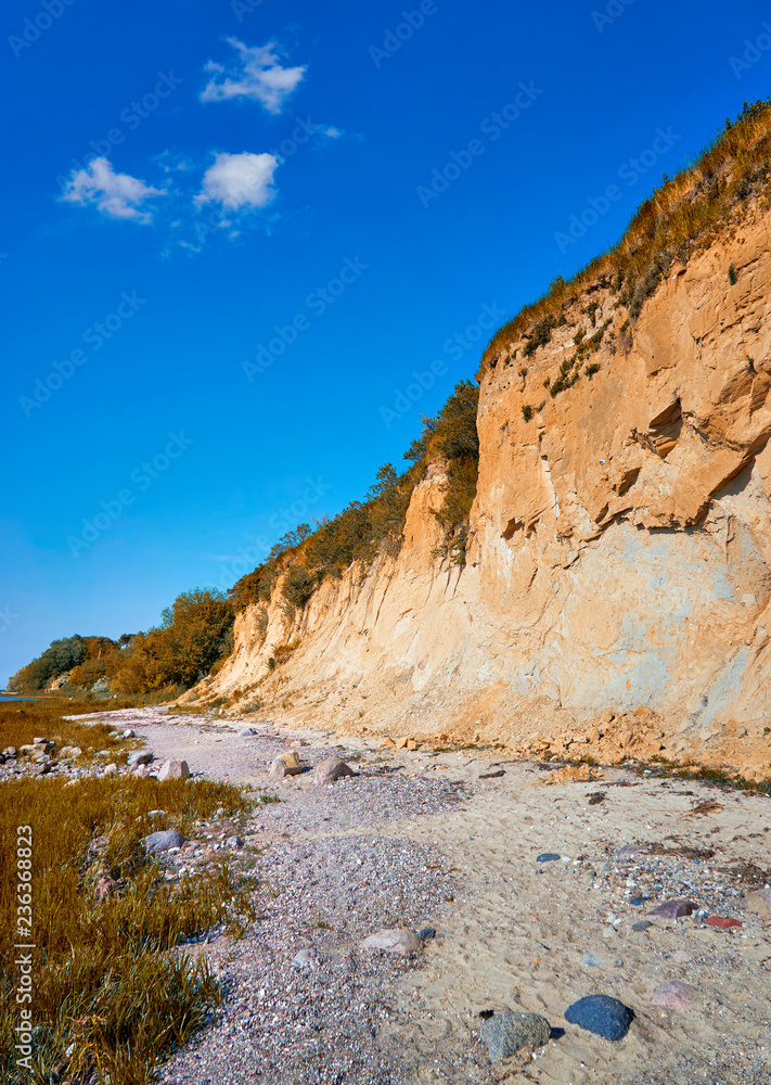 Sandy Baltic Sea cliff at the Baltic Sea beach.