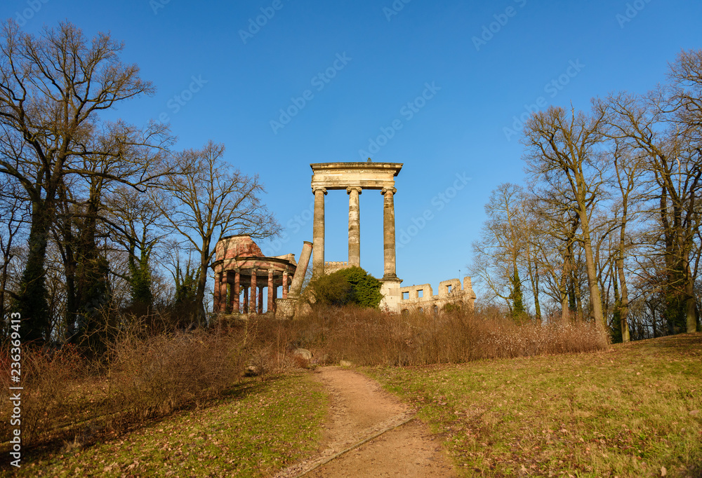 Outdoor scenery of remain ruin ancient Norman tower on the ruinenburg mountain, Normannischer Turm auf dem Ruinenberg, surrounded with park and tree without leave in Potsdam, Germany in winter season.