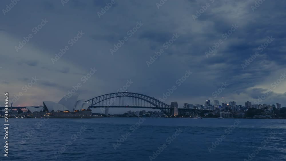 Holy grail timelapse of evening in Sydney, Australia with its most iconic building - Sydney Opera House and Sydney Harbour Bridge. Smooth transition from day to night. Holy grail timelapse of evening in Sydney, Australia with its most iconic building - Sydney Opera House and Sydney Harbour Bridge. Smooth transition from day to night.