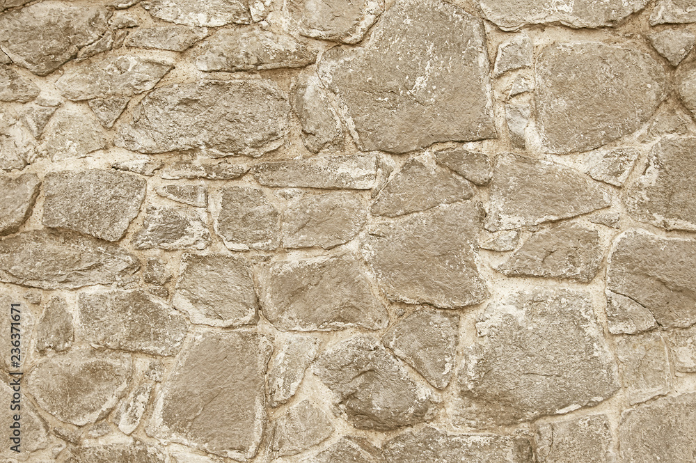 Old beige stone wall background texture Old beige stone wall background texture