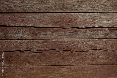 Old dark brown wooden fence background texture