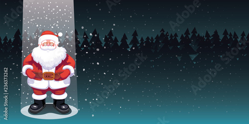 Cute Santa Claus standing in a beam of light on a dark forest background