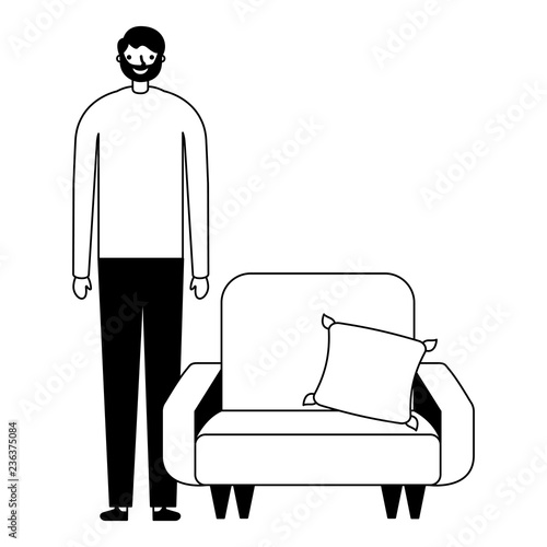 man standing near sofa with cushion