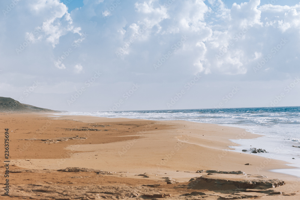 Beautiful empty beach.The sea and the sunset.Wild beach Beautiful empty beach.The sea and the sunset.Wild beach