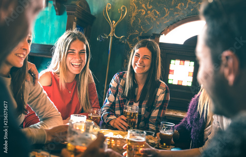 Photography Group of happy friends drinking beer at brewery bar restaurant - Friendship conc