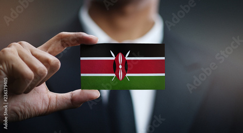 Businessman Holding Card of Kenya Flag