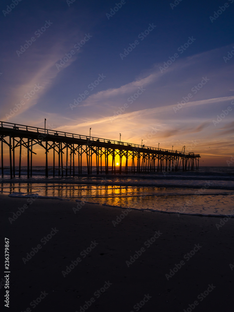 Silhouette of pier at sunset in Carolina Beach, North Carolina, USA