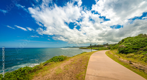 Paved hiking trail & bike path along the beach in Kauai, Hawaii, USA