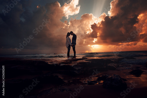 Couple in love at a fiery sunset.Silhouette photo