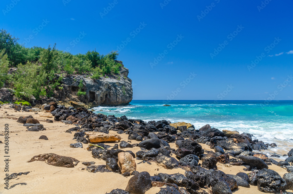 Rocks & cliff along Shipwrecks Beach in Kauai, Hawaii, USA