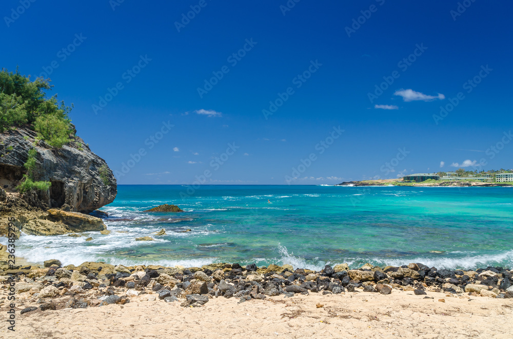 Rocks alone the shore at Shipwreck Beach in Kauai, Hawaii, USA Rocks alone the shore at Shipwreck Beach in Kauai, Hawaii, USA