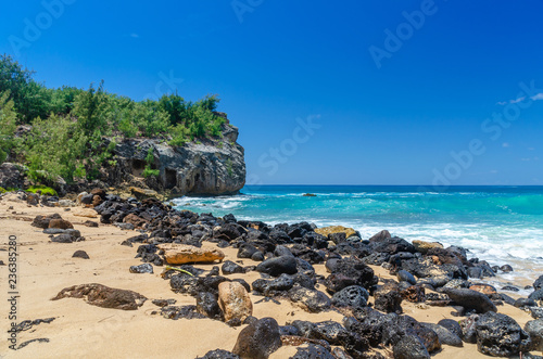 Rocks & cliff along Shipwrecks Beach in Kauai, Hawaii, USA