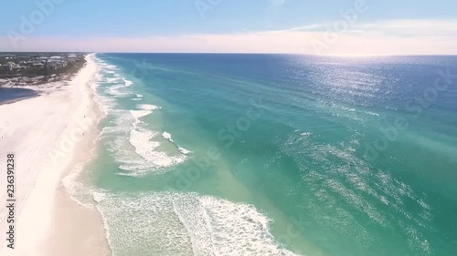 Aerial view of couple walking on beach