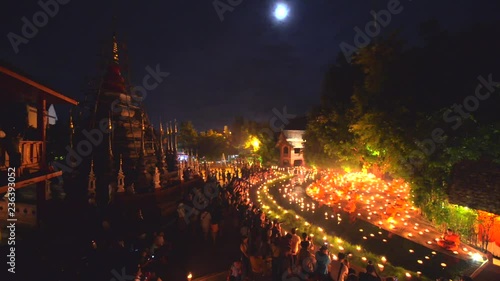 CHIANG MAI THAILAND-July 30 2015 : Unidentified monks meditate around Buddha statue among many candle at Pan Tao temple.