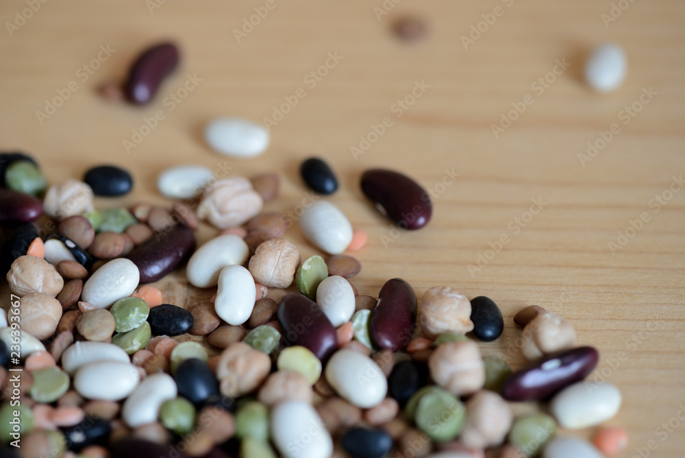 Mix of different beans on wooden background close up Mix of different beans on wooden background close up