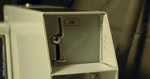 4k Insert coins into laundry
