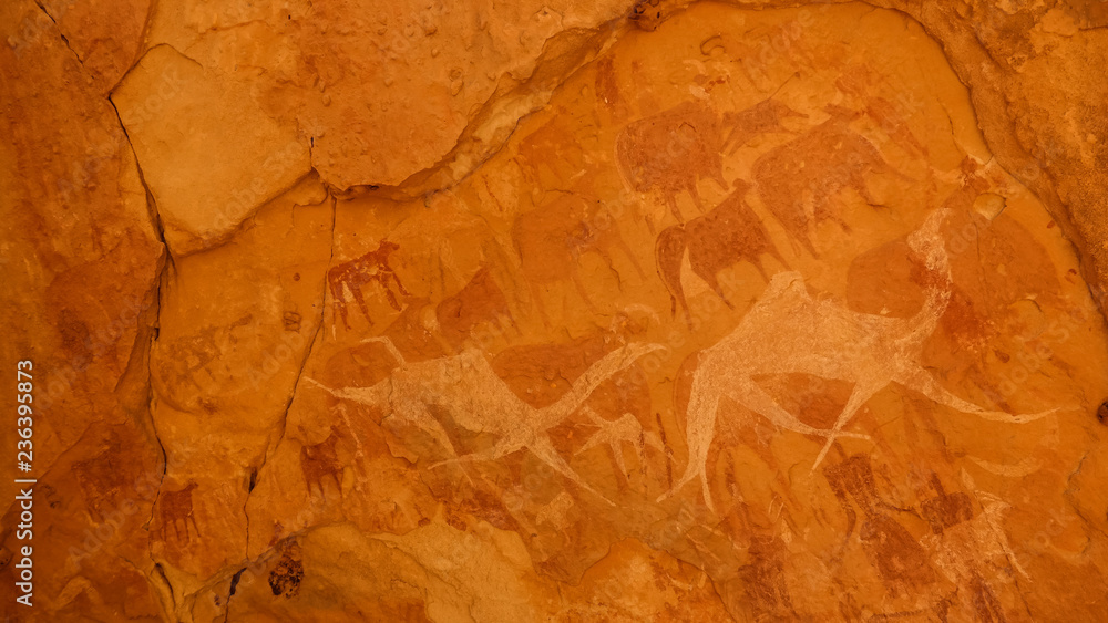 Cave paintings and petroglyphs in Bichagara Cave camel, cow , Ennedi, Chad