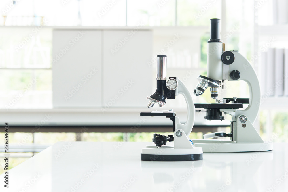 Microscope with metal lens for research and medical equipment in laboratory Microscope with metal lens for research and medical equipment in laboratory