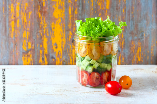 Fresh vegetable salad in a mason jar. Trends in healthy eating.