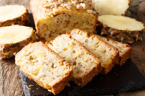 Fruit bread with pineapples, walnuts and raisins close-up. horizontal