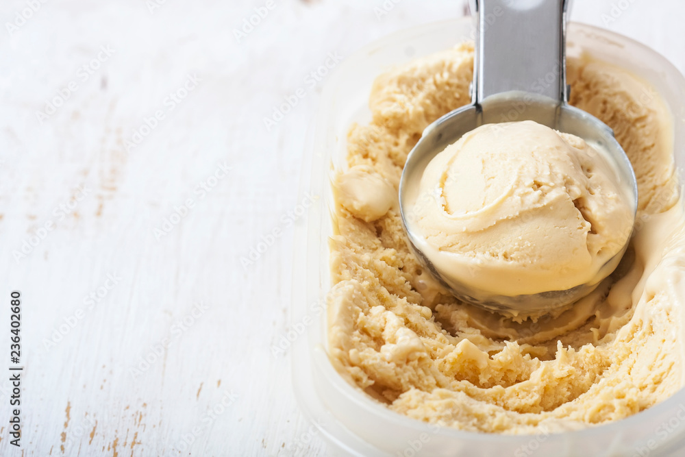 Homemade creamy ice cream in metal scoop Homemade creamy ice cream in metal scoop
