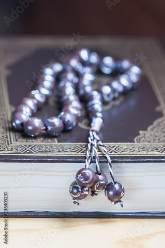 Prayer beads on the Koran. Selective focus