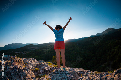 Girl at the top of the mountain. © zhukovvvlad