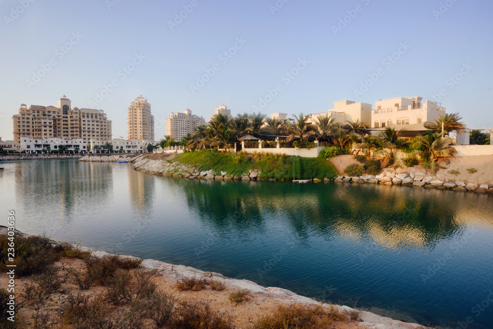 September 12, 2017 - Al Hamra Village in Ras al Khaimah, United Arab Emirates. Modern arabian district area with apartment buildings, palms and hotels in Persian gulf.