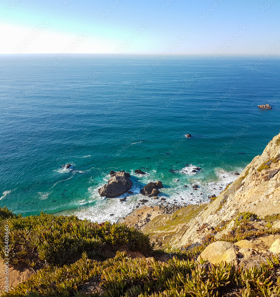 Cliffs over the Atlantic ocean. The westernmost point in Europe. The edge of the land. Cape Roca or Cabo da Roca, Portugal.