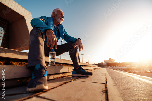 Senior man running in the city