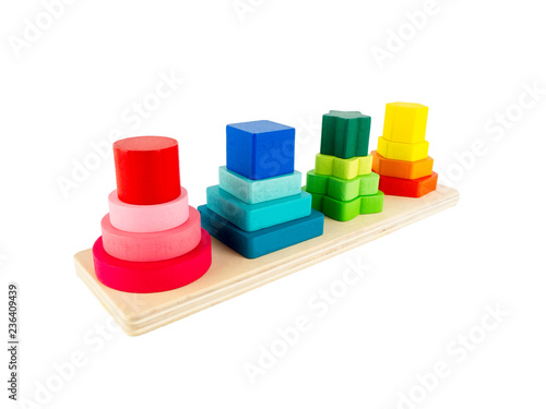 Wooden toy geometric four column with different size for child development isolated on a white background, Logical thinking or problem solving.